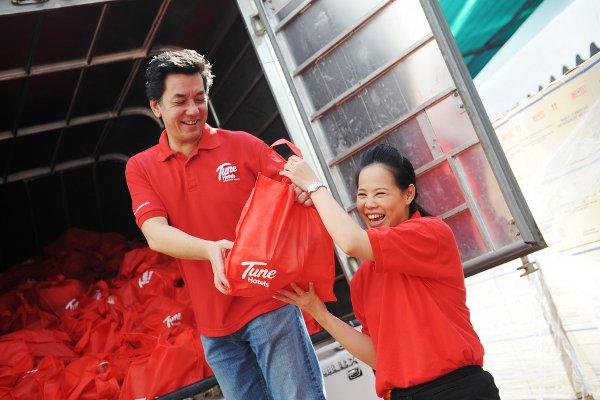 Tune Hotels presenting aid donation to Thai flood victims in Bangkok
